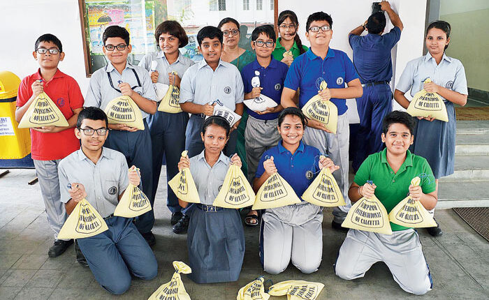Students donating rice to be distributed in schools where children from marginalised families study