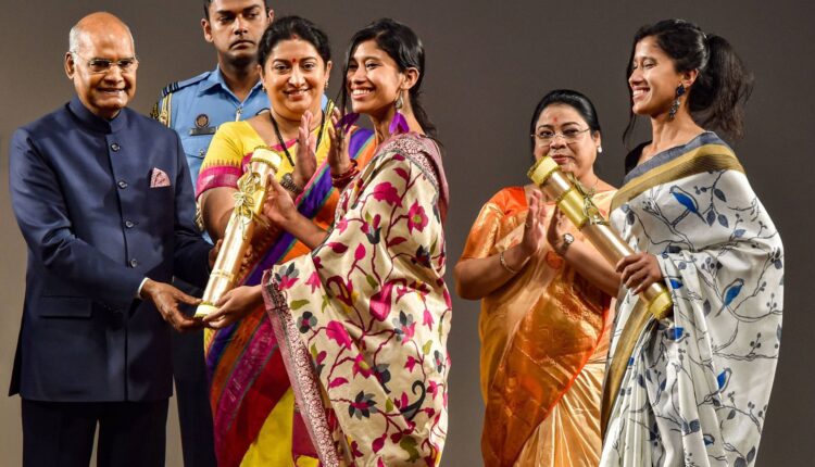Mountaineers Tashi Malik and Nungshi Malik receive Nari Shakti Puraskar 2019 on International Womens Day from President Ram Nath Kovind as Union Minister Smriti Irani looks on, at Rashtrapati Bhavan Cultural Center in New Delhi, Sunday, March 8, 2020